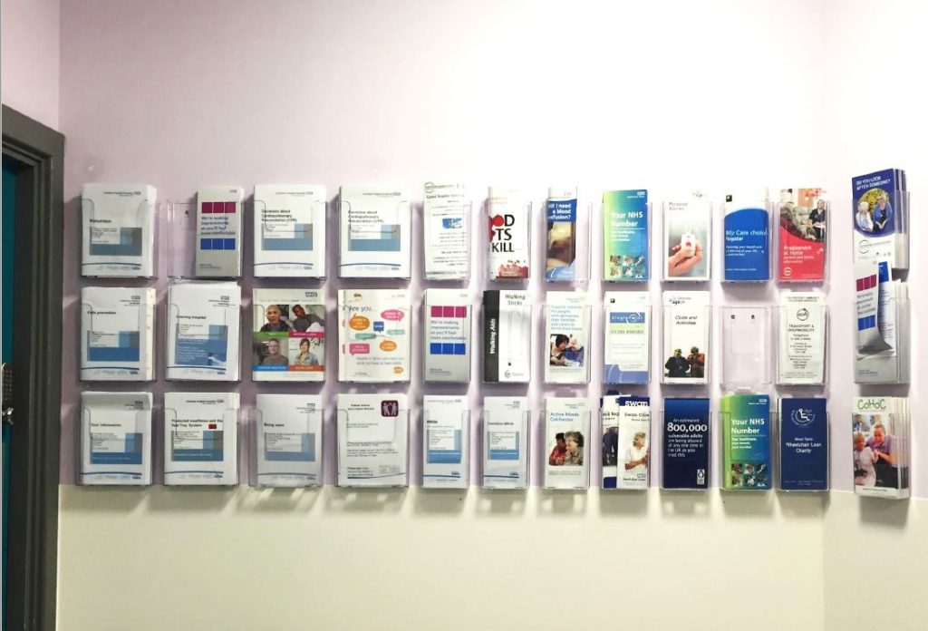 Over 30 different leaflets advice leaflets mounted on a wall